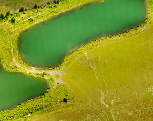 Aerial view of green watershed creek